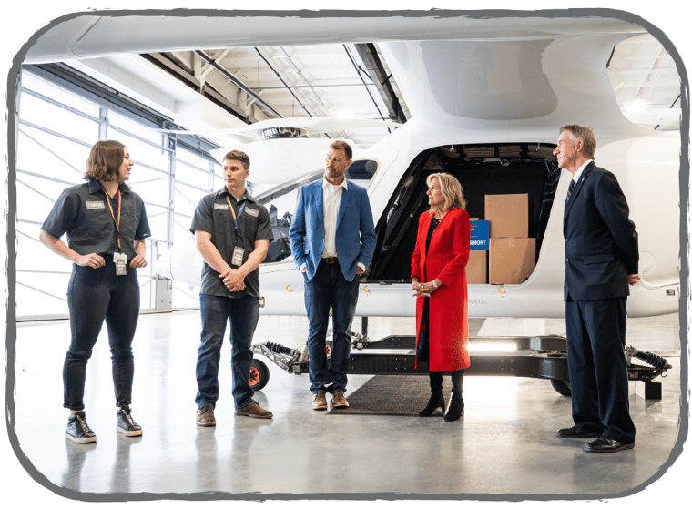 Jill Biden and Kyle in front of the plane
