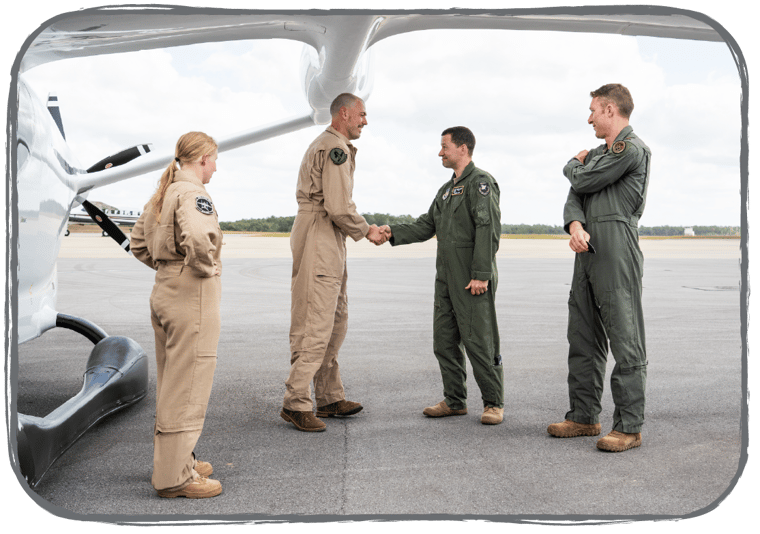 Kyle shaking the hand of a member of the DOD