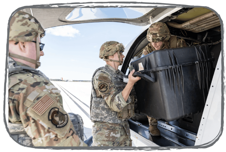 A military team member loading cargo into ALIA