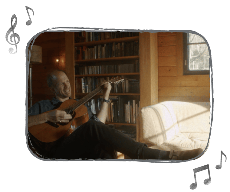 An image of Ryan Ober playing the guitar